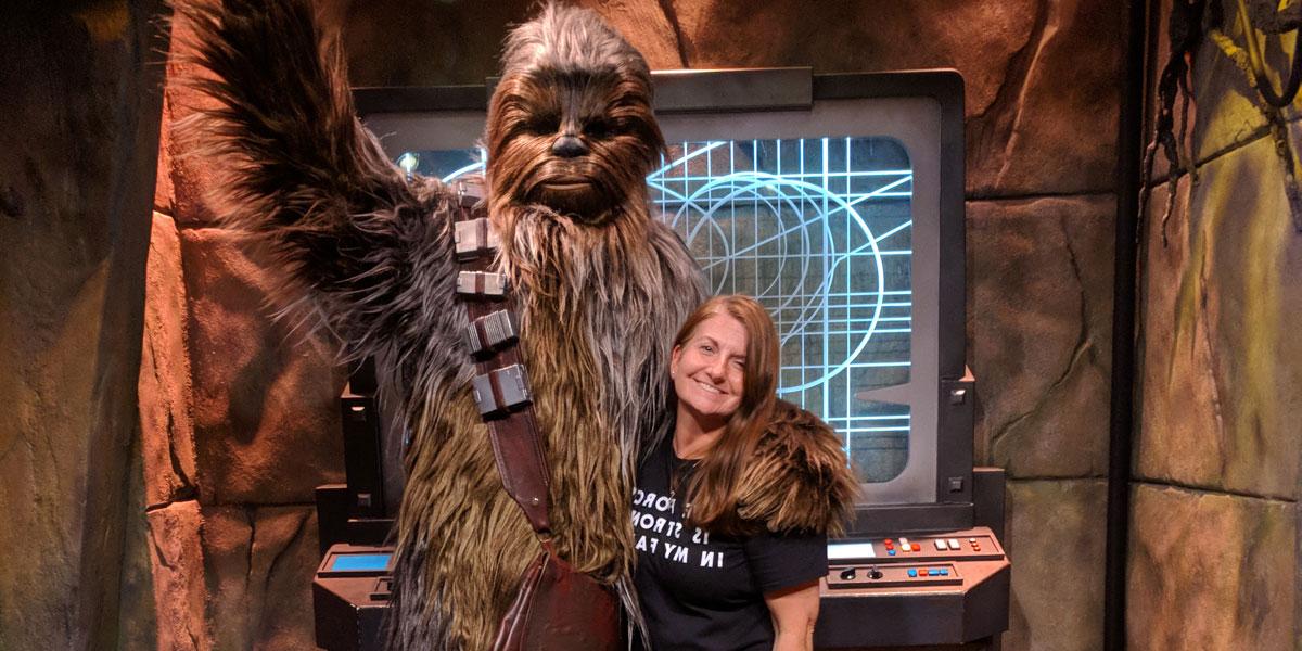 1200x600 of Stephanie Goldenberg posing with Chewbacca